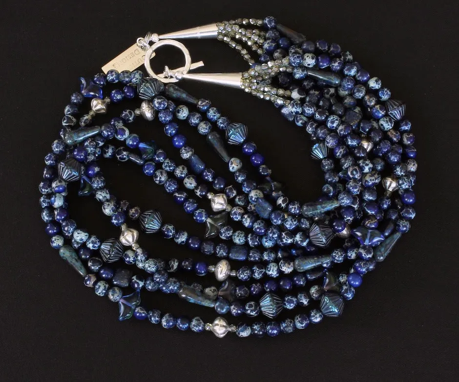 Blue Sea Sediment Jasper Rounds 5-Strand Necklace with Hill Tribe Silver Fluted Bicones & Stamped Rondelle Beads, Lapis Lazuli Squares, Czech Glass Ridged Bicones & Teardrops, and Sterling Silver Cones & Hammered Toggle Clasp