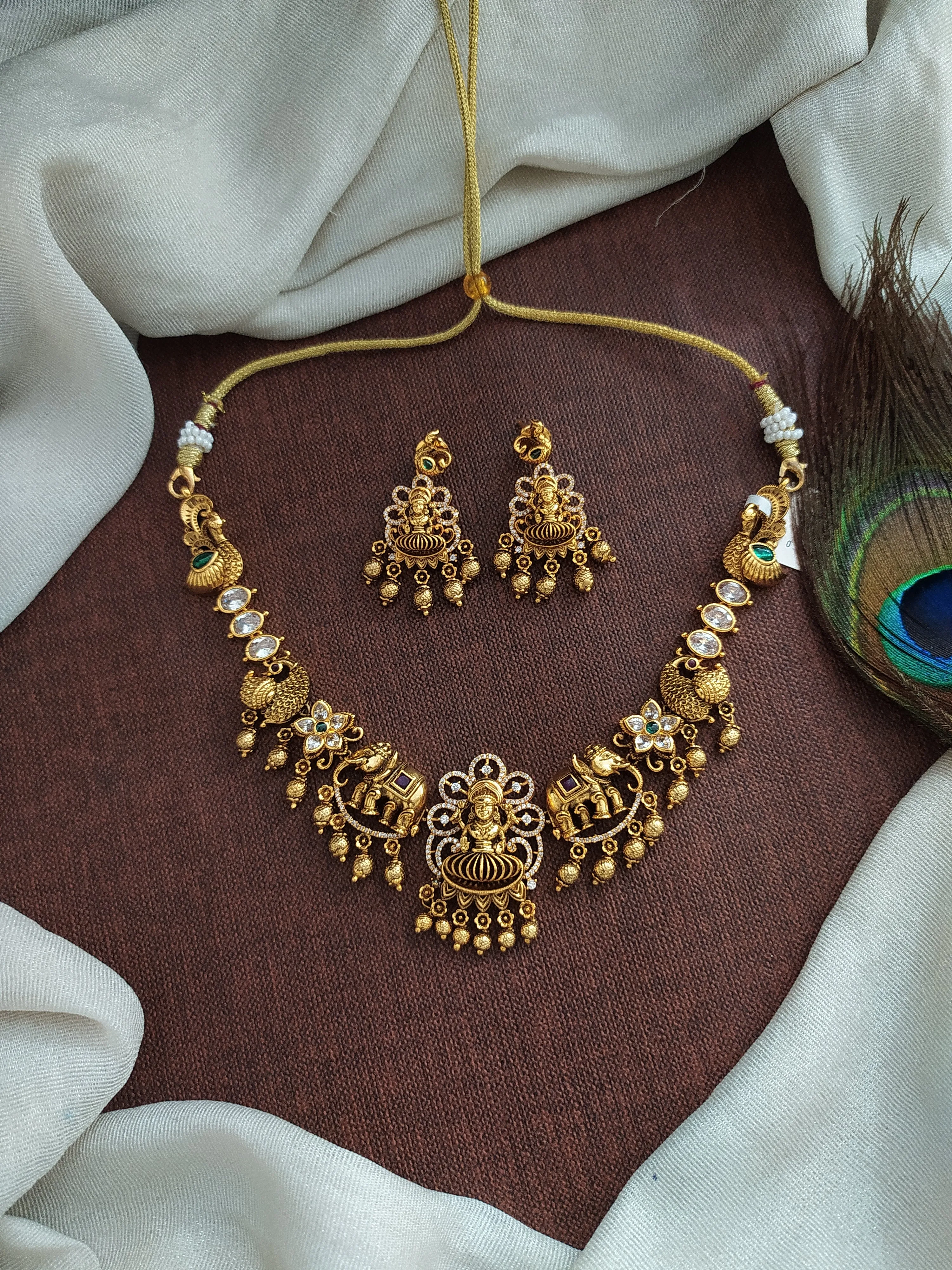 "Antique Lakshmi Necklace Set with Trending Zircon Stones and Nagas Work"